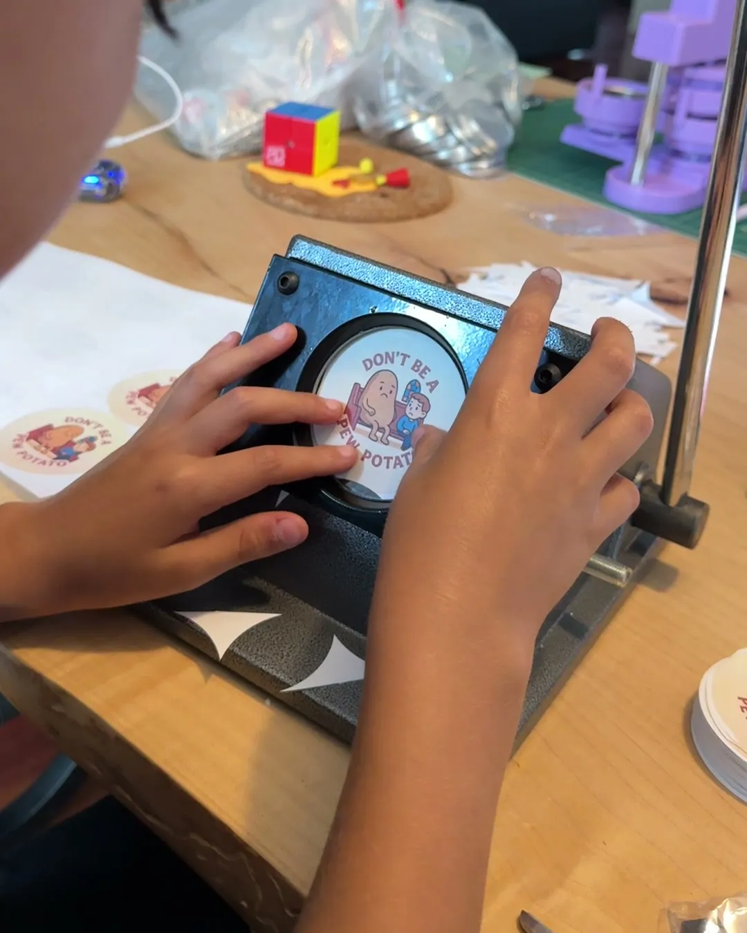 Hands working at a button press
