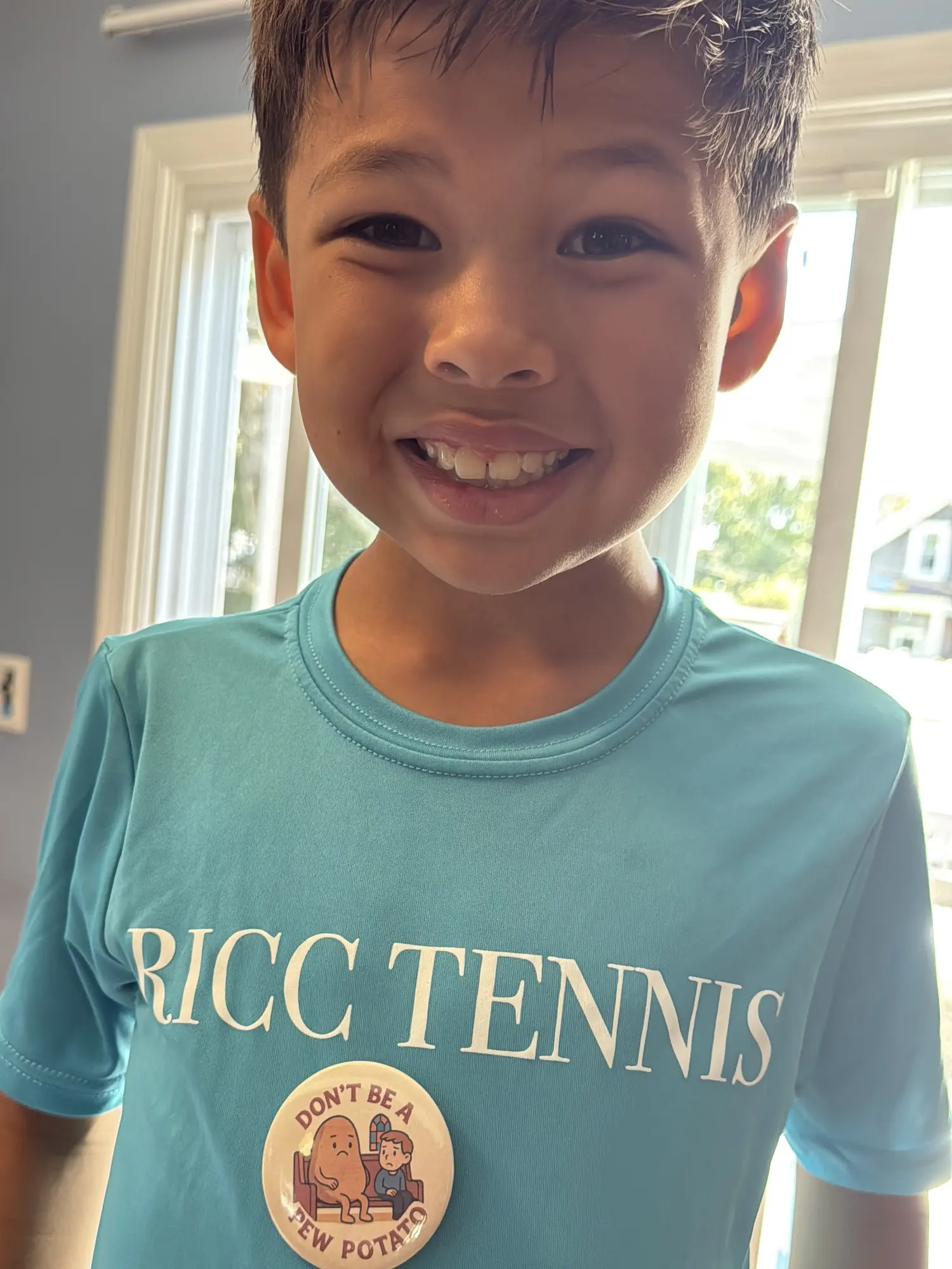 Child wearing a finished button